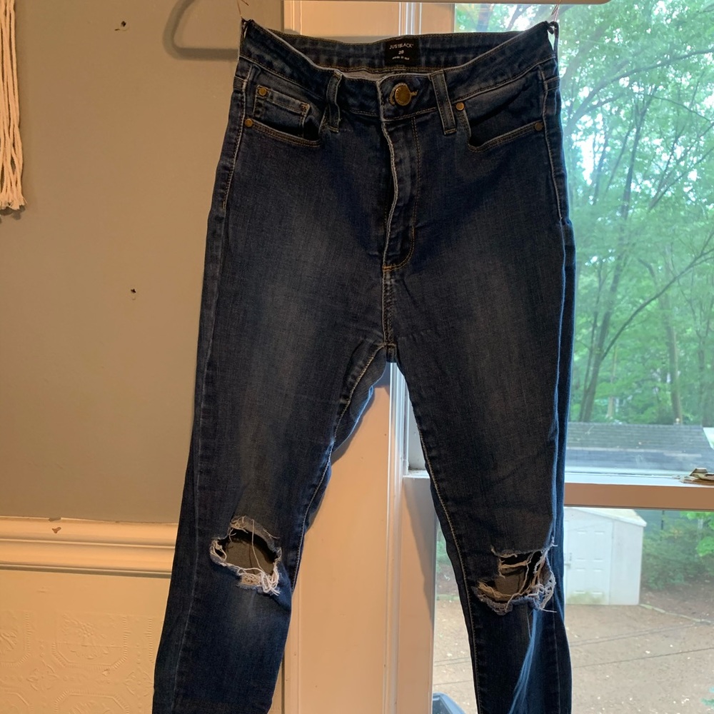 Just Black Jeans with knee holes and cuffed hem.